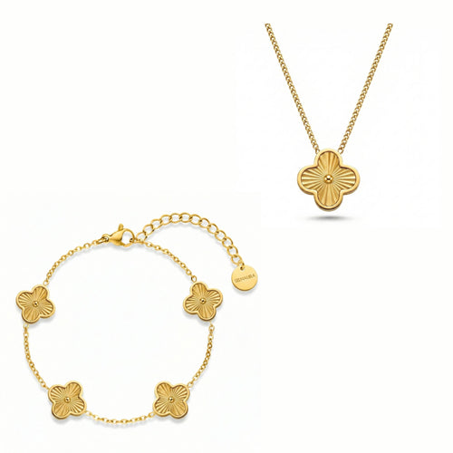 Golden Radiance Schmuck Set mit goldfarbener Kette und Armband mit strukturiertem Kleeblatt Design, hochwertig arrangiert auf reinweißem Hintergrund.