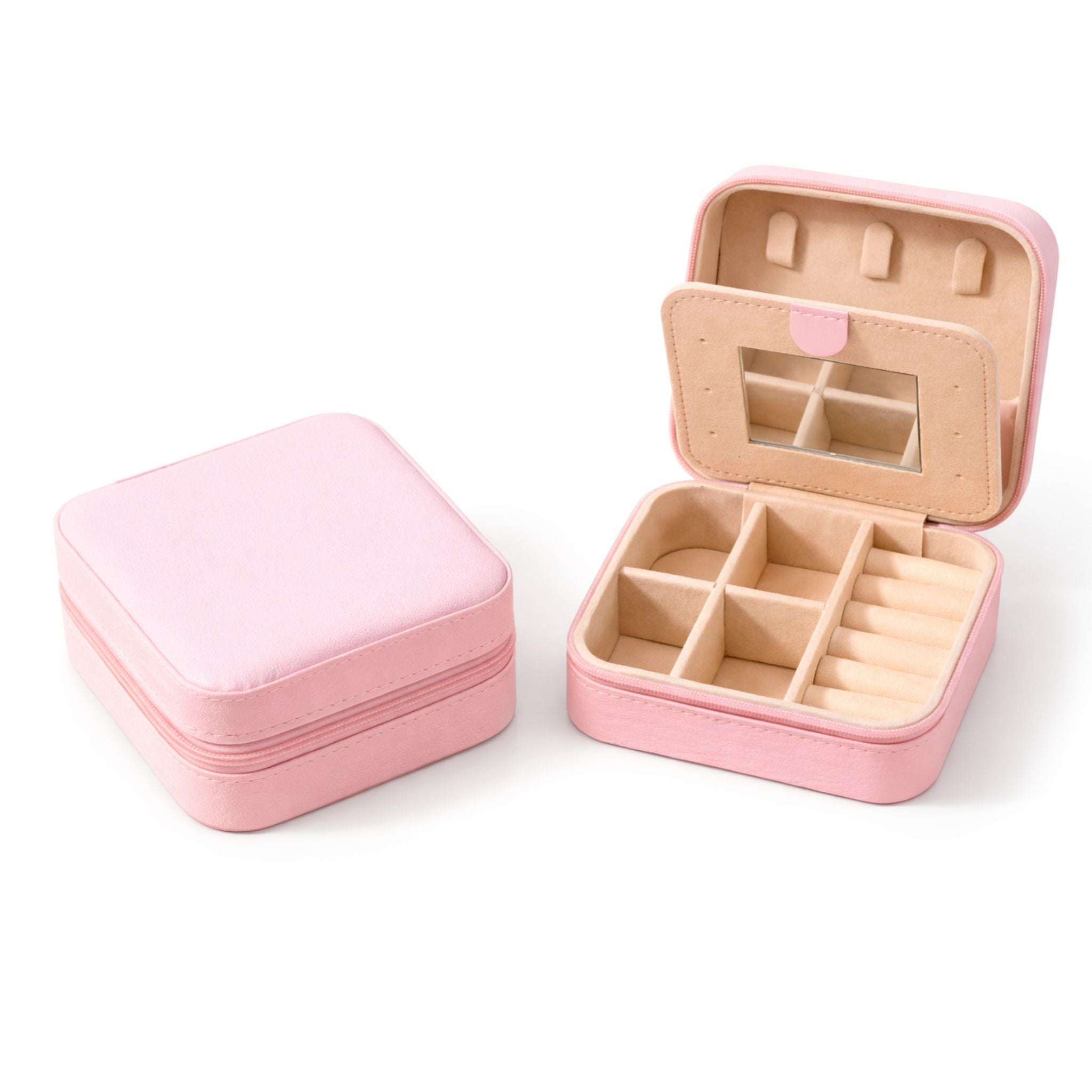 Kompakte Schmuck-Reisebox in Rosa mit Reißverschluss, Spiegel und Fächern für Ringe, Ketten und Ohrringe.