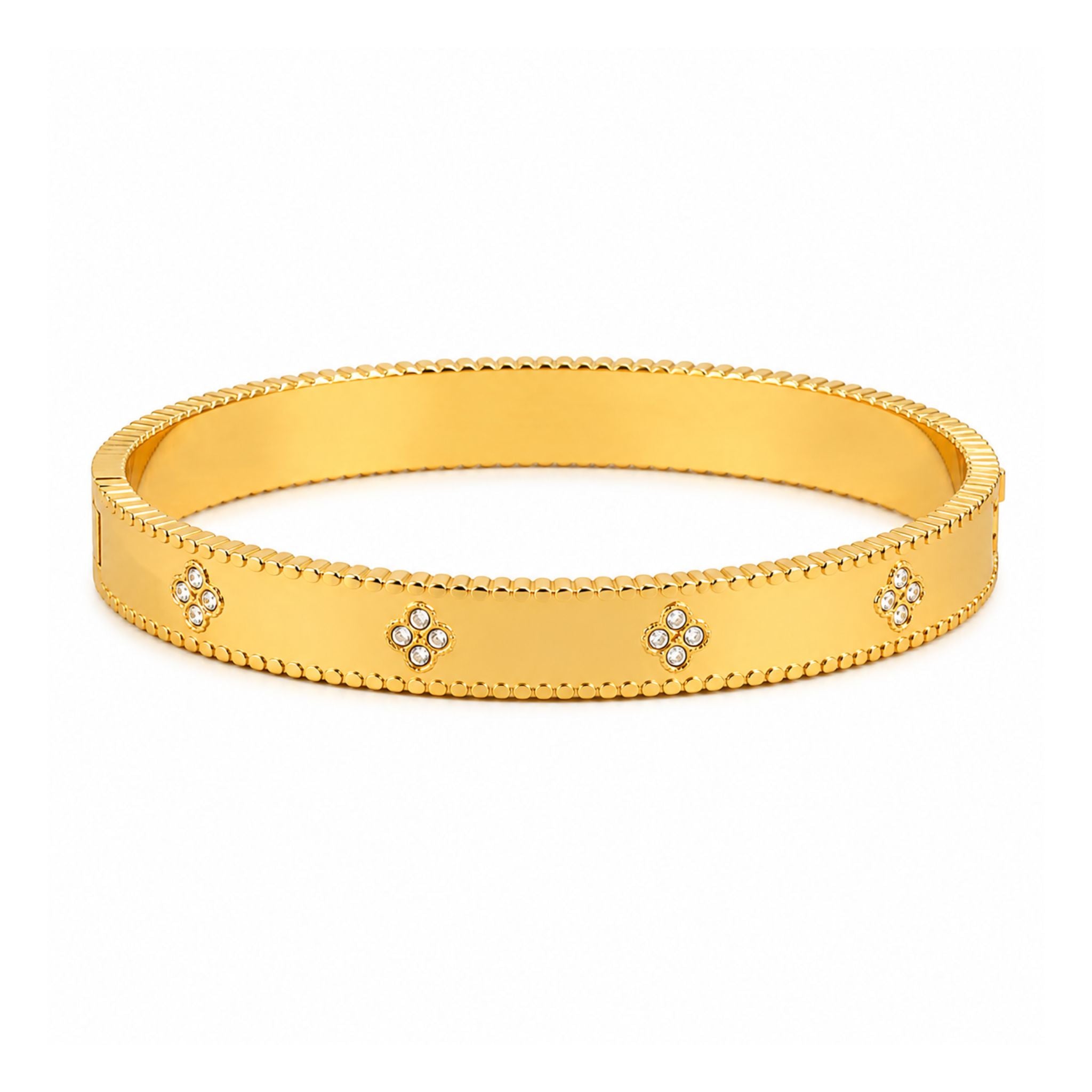 Goldener Armreif mit Blumenmuster und funkelnden Zirkonia