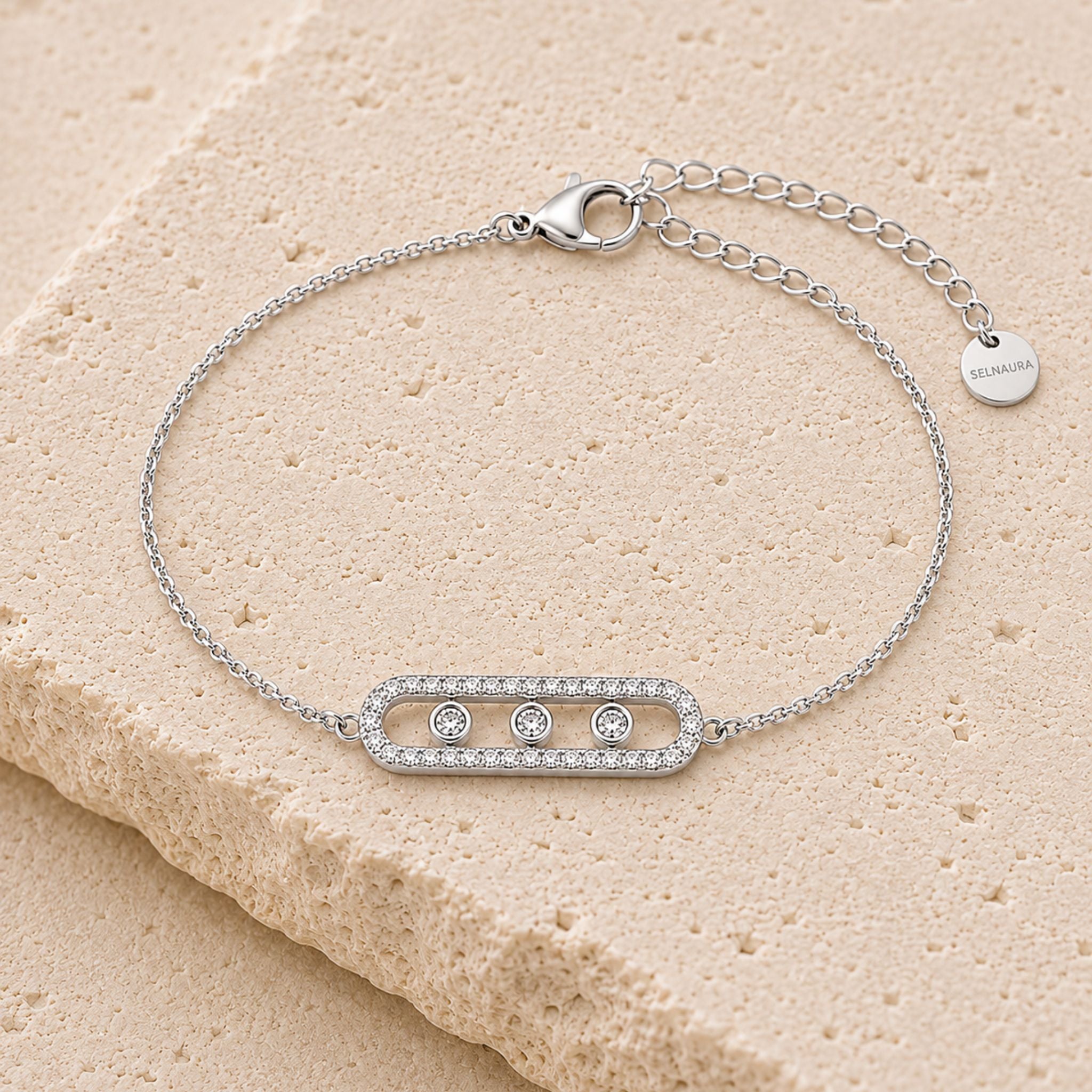 Trinity Shine Armband Silber mit funkelnden Zirkonia auf hellem Naturstein
